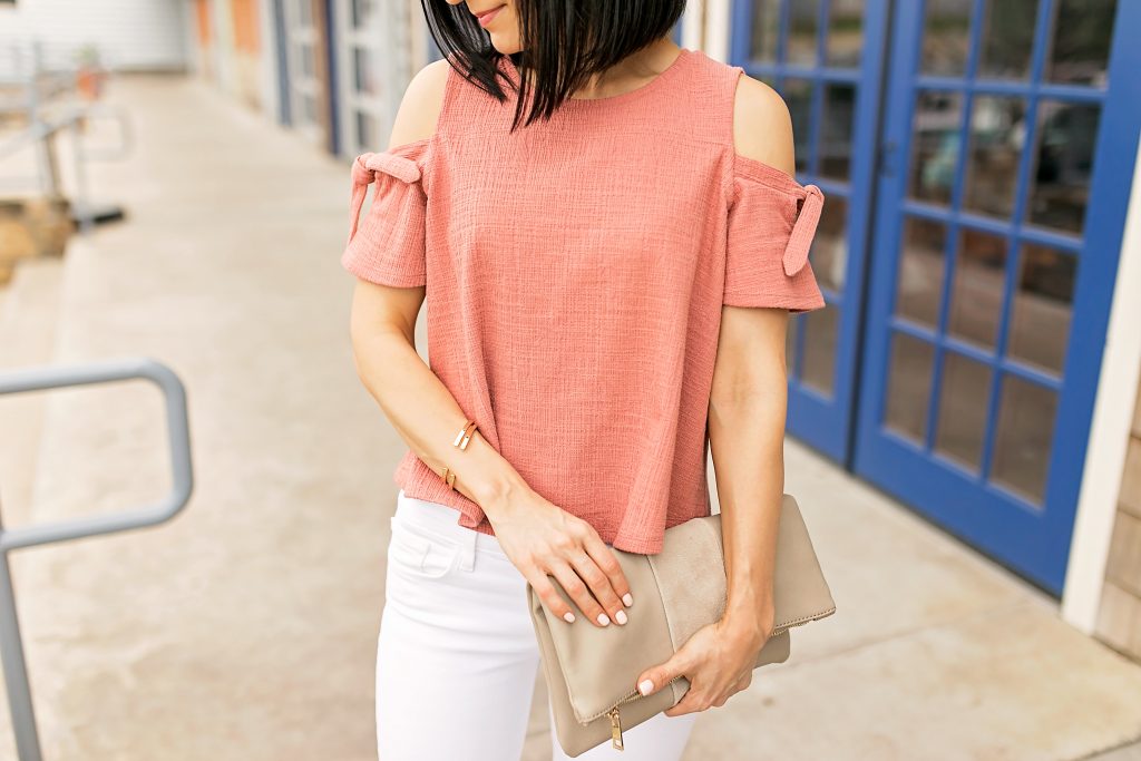 How to style white jeans and a cold shoulder top with nude block heel pumps.