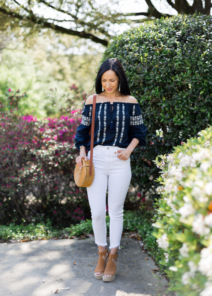 Off shoulder top and white jeans spring/summer outfit with Marc Fisher espadrilles and straw wicker circle handbag